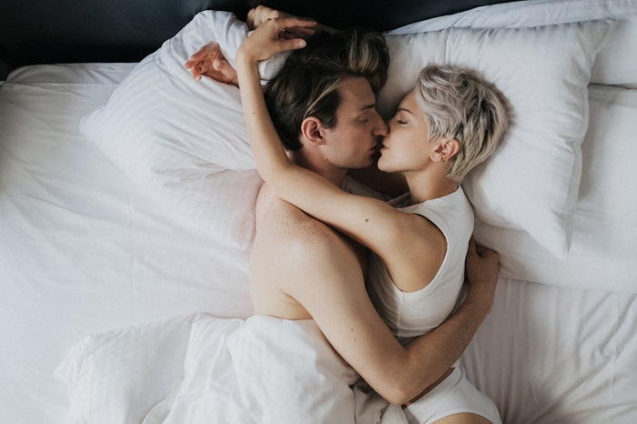 Photo by cottonbro studio: https://www.pexels.com/photo/a-romantic-couple-kissing-on-the-bed-9374137/